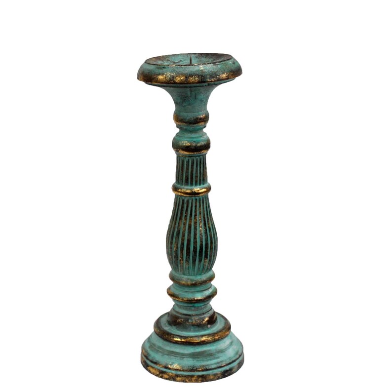 May include: A teal blue candle holder with gold accents. The holder is made of wood and has a classic design.