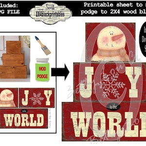May include: A digital download sheet for creating Christmas-themed wood block signs. The image shows a snowman, the word "JOY" with a snowflake, and "to the WORLD" on red backgrounds. Includes instructions and materials like wood blocks and Mod Podge.