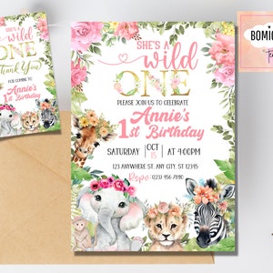 May include: Pink and green jungle-themed first birthday party invitation with a watercolor illustration of a giraffe, elephant, lion, and zebra wearing floral crowns. The text reads "She's a Wild One" and "Annie's 1st Birthday".