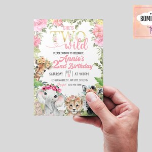 May include: A pink and gold birthday invitation with a floral border and a jungle animal theme. The text reads "She's Two Wild" and "Annie's 2nd Birthday".