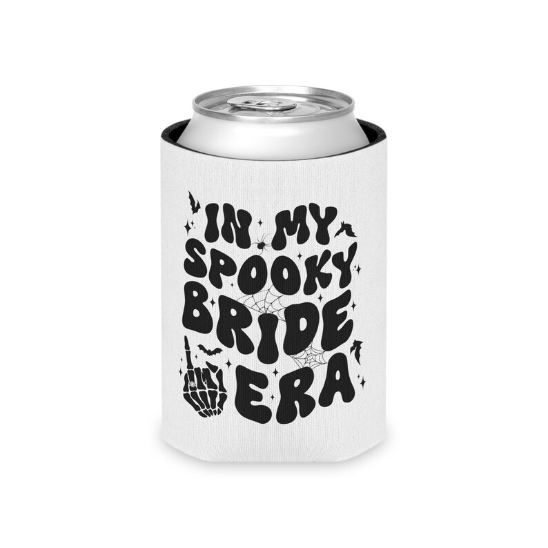 May include: White can cooler with black text that reads "In My Spooky Bride Era". The text is in a retro font and is surrounded by bats, spiders, and spiderwebs.