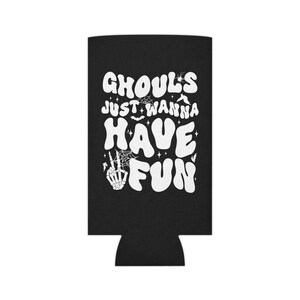 May include: Black can cooler with white text that reads "Ghouls Just Wanna Have Fun". The text is in a retro font with a spooky Halloween theme. There are small bats and spiderwebs around the text.