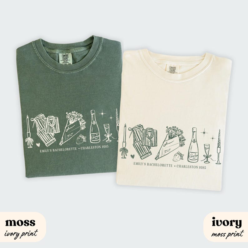 May include: Two t-shirts, one moss green and one ivory, each with a white graphic. The graphic includes a champagne bottle, glasses, pajamas, flowers, and text that reads "EMILY'S BACHELORETTE &bull; CHARLESTON 2025".
