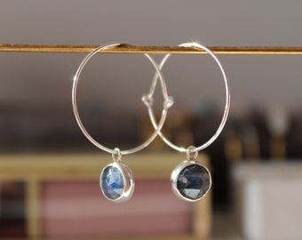 Silver hoop earring with sapphire