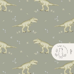 May include: A repeating pattern featuring watercolor illustrations of light green Tyrannosaurus Rex dinosaurs on a muted sage green background. Small blue and white leaf accents are scattered throughout. The design includes the text "Hej Hanna" and a bear illustration.