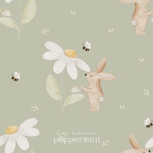 May include: Watercolor illustration featuring a repeating pattern of a bunny watering a daisy, with bees and leaves on a sage green background. The text "hey hanni peppermint" is at the bottom. The design has a soft, whimsical feel.