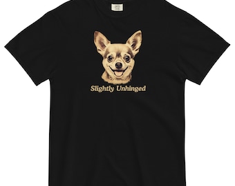 May include: Black t-shirt featuring a smiling chihuahua with the text "Slightly Unhinged" in a vintage font. The dog's portrait is in sepia tones, contrasting with the shirt's dark background. The shirt has a classic crew neck.