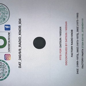 May include: A white card with black text that reads "DAT_240/6/8_RADIO_KNOB_834" and "FITS/FOR DATSUN/NISSAN". The card also includes the text "DISCONTINUED BY DATSUN/NISSAN" and "FACTORY RADIO KNOB".