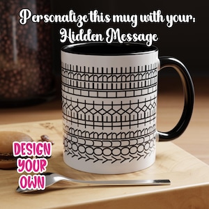 May include: White ceramic mug with a black interior and handle, featuring a black geometric pattern. The mug is on a wooden surface with a spoon and text that says "Design Your Own" and "Personalize this mug with your: Hidden Message."