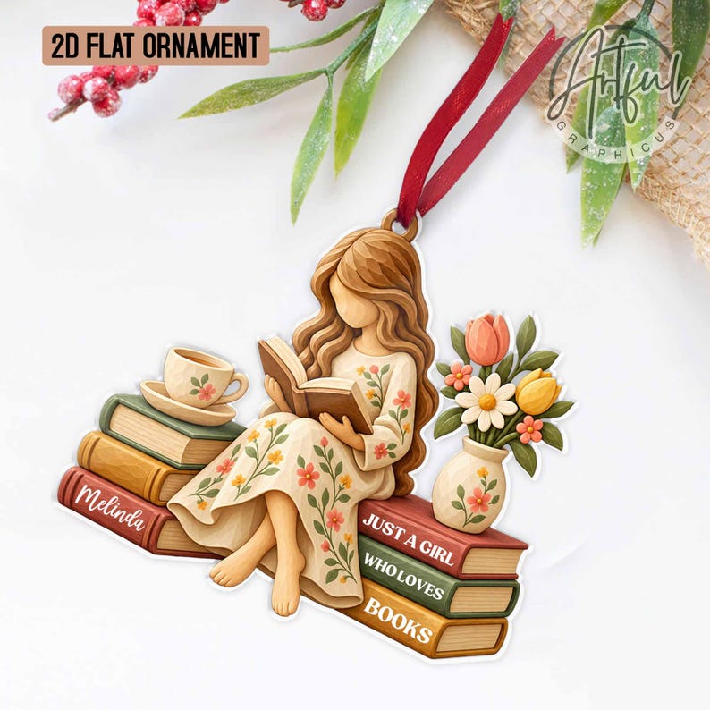 May include: A 2D flat ornament featuring a person with long brown hair reading a book while sitting on a stack of books. The person wears a cream dress with floral patterns. The ornament includes a teacup, a vase of flowers, and text reading Melinda and JUST A GIRL WHO LOVES BOOKS, suspended by a red ribbon.