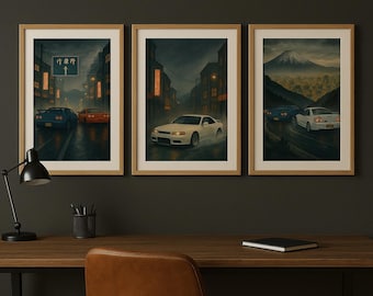 May include: Set of three framed art prints featuring Japanese street racing scenes. Each print depicts cars on wet roads at night, with cityscapes and a mountain in the background. The prints are in wooden frames.
