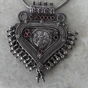 Antique silver die - stamped amulet (mandaliya).