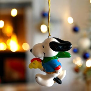 Vintage Snoopy and Woodstock ceramic ornament. Woodstock hobby horse. Super cute and Collectable