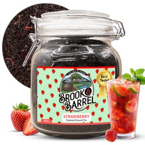 May include: A glass jar filled with loose leaf tea, labeled "Strawberry Premium Flavored Tea" by Brook & Barrel. A strawberry drink with lime and mint is next to the jar. A fresh strawberry and a circle of tea leaves are also in the image. The jar contains 25 oz of tea.
