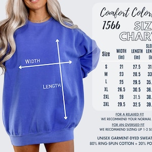 May include: A blue unisex garment-dyed sweatshirt with a size chart. The chart lists measurements in inches for width, length, and sleeve length for sizes S through 3XL. The sweatshirt is 80% ring-spun cotton and 20% polyester.