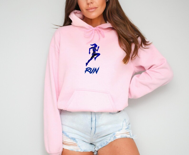 May include: Pink hoodie with a blue silhouette of a running woman and the word "RUN" in blue lettering.