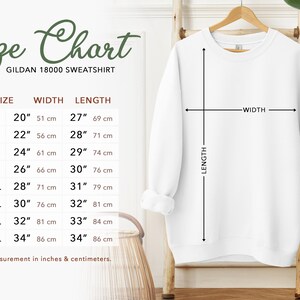 May include: Size chart for a Gildan 18000 sweatshirt, showing measurements in inches and centimetres for sizes S to 5XL. The chart shows width and length measurements for each size.