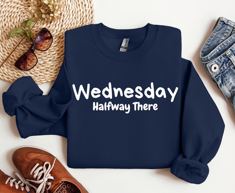 May include: A navy blue sweatshirt with white text that reads "Wednesday Halfway There".