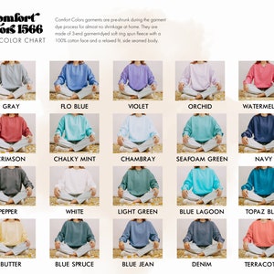 May include: Color chart of Comfort Colors 1566 sweatshirts in various colors, including gray, blue, violet, orchid, and watermelon. Each sweatshirt is displayed on a person sitting cross-legged. The chart also includes the text: "Comfort Colors garments are pre-shrunk..."
