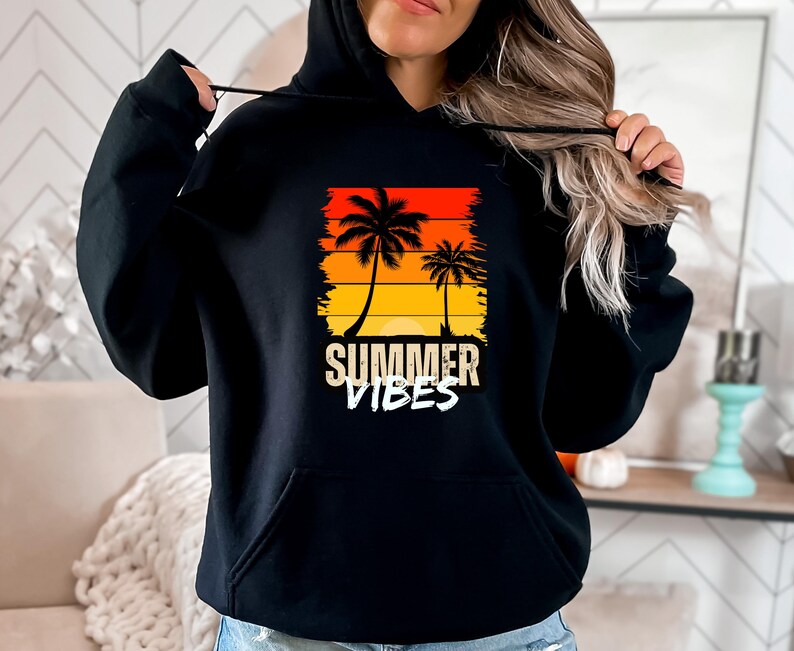 May include: Black hoodie with a graphic of palm trees and a sunset. The text "Summer Vibes" is printed below the graphic.