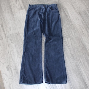 Vintage 1970s navy blue corduroy Levis white tab flared boot cut pants
