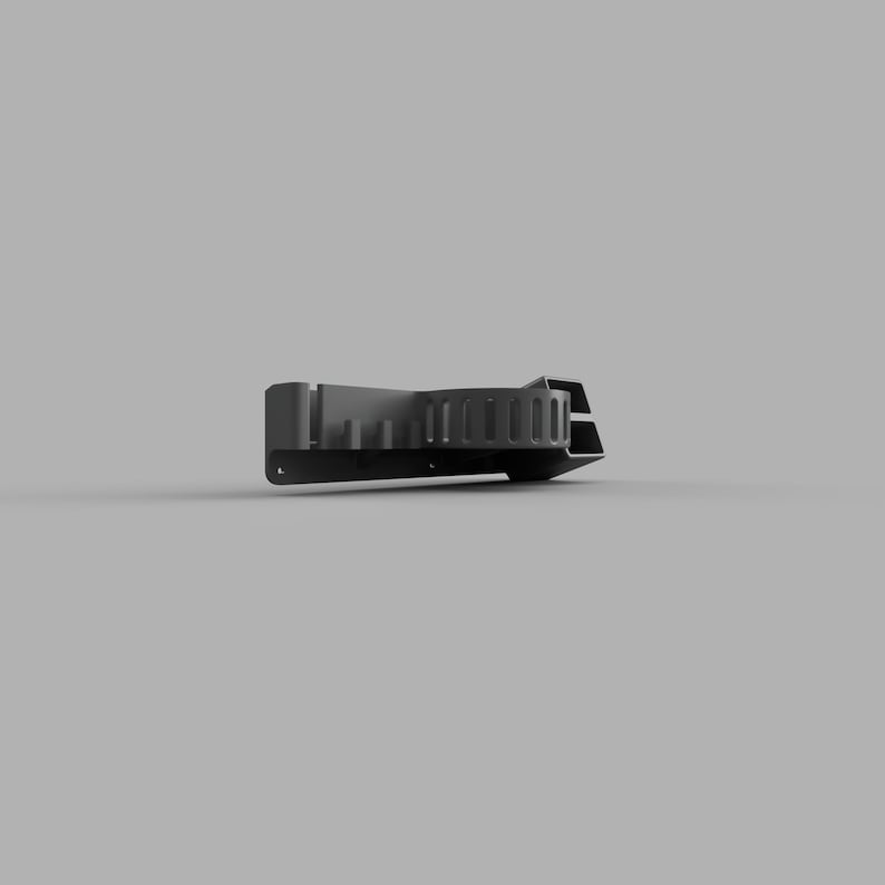 May include: A black plastic wall mount with a series of slots and holes for organising tools or other items.