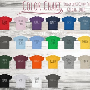 May include: Color chart showing 20 different t-shirt colors. The colors are arranged in four rows of five. The colors are: red, light pink, purple, navy, royal, indigo blue, charcoal, light blue, Carolina blue, Irish green, dark heather, daisy, forest green, maroon, orange, gold, sport grey, sand, black, ash, light blue, and charcoal.