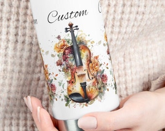 May include: White stainless steel water bottle with a custom design featuring a watercolor illustration of a violin with floral accents. The text "Custom" is printed on the bottle.