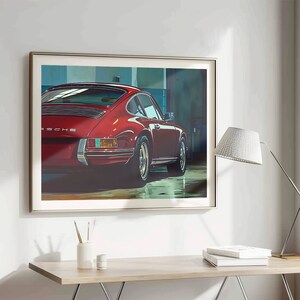May include: A red Porsche 911 car in a garage setting. The car is facing away from the camera and the rear of the car is in focus. The car has a black interior and a black license plate with the word "Porsche" on it.