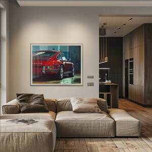 May include: A framed print of a red Porsche 911 in a garage setting. The car is facing away from the camera and the rear of the car is in focus.