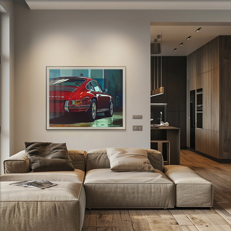May include: A framed print of a red Porsche 911 in a garage setting. The car is facing away from the camera and the rear of the car is in focus.