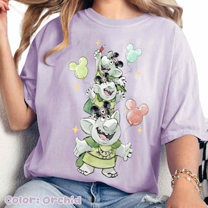 May include: A set of three ceramic mugs with a speckled, matte finish. The mugs are in shades of cream, light gray, and dark gray. Each mug has a simple, minimalist design, perfect for coffee or tea.