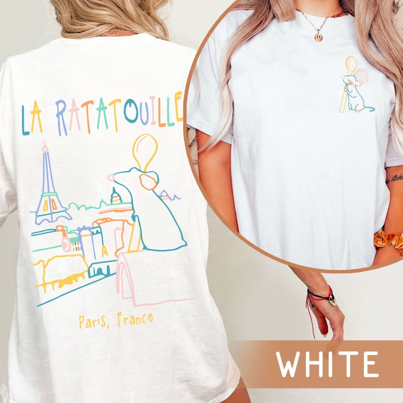 May include: White t-shirt with a graphic of a rat holding a spoon in front of the Eiffel Tower and the text "La Ratatouille, Paris, France".