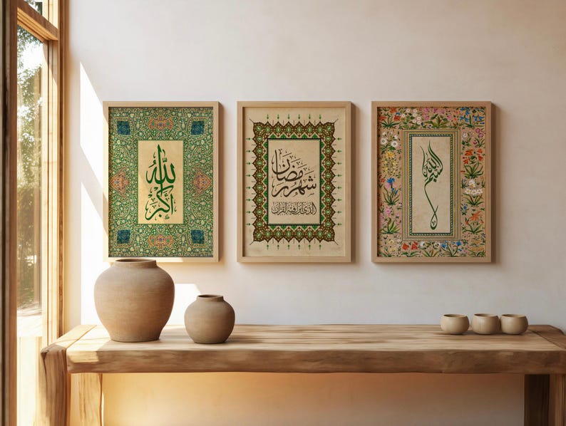 May include: Three framed Islamic calligraphy art prints. The prints feature ornate borders and Arabic script in green and black on a beige background. The frames are light wood. Two ceramic vases and three small bowls sit on a wooden table.