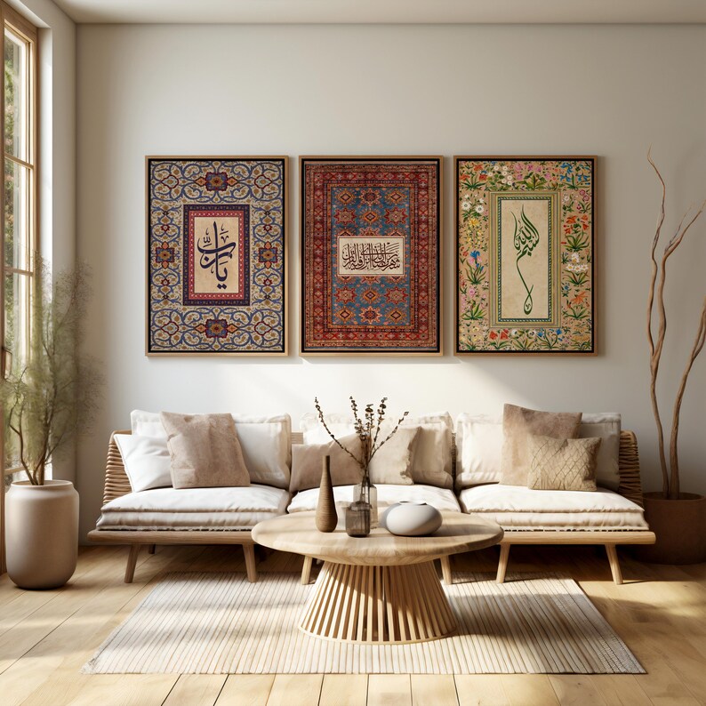 May include: Three framed art pieces with ornate designs and Arabic calligraphy hang above a light-colored sofa. The artwork features intricate patterns in shades of blue, red, and gold, creating a decorative and cultural aesthetic. A wooden coffee table and neutral-toned rug complete the living room setting.