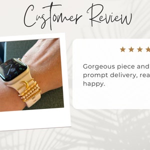 May include: A white Apple Watch with a gold moon and star design on the band. The band is made of a white silicone material and has a gold chain detail. The watch face is black and shows the time and date.