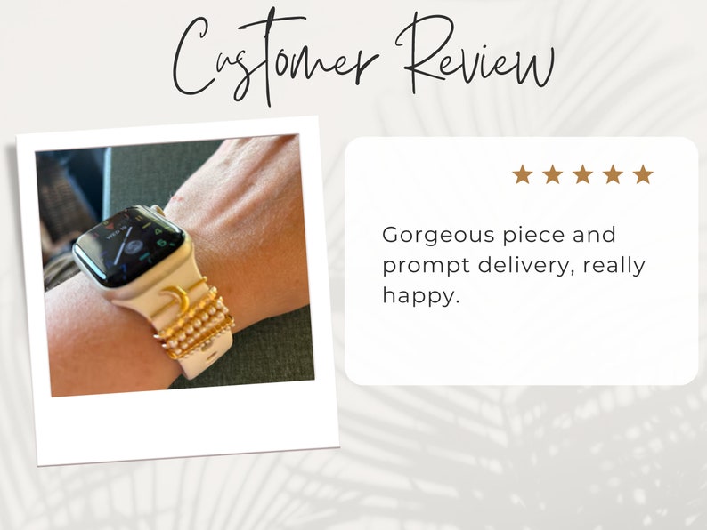 May include: A white Apple Watch with a gold moon and star design on the band. The band is made of a white silicone material and has a gold chain detail. The watch face is black and shows the time and date.