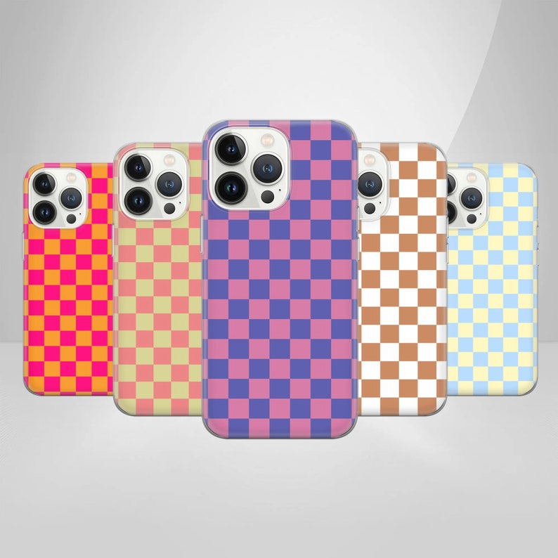 May include: Five different phone cases with a checkered pattern. The cases are in pink, orange, yellow, brown, and blue.