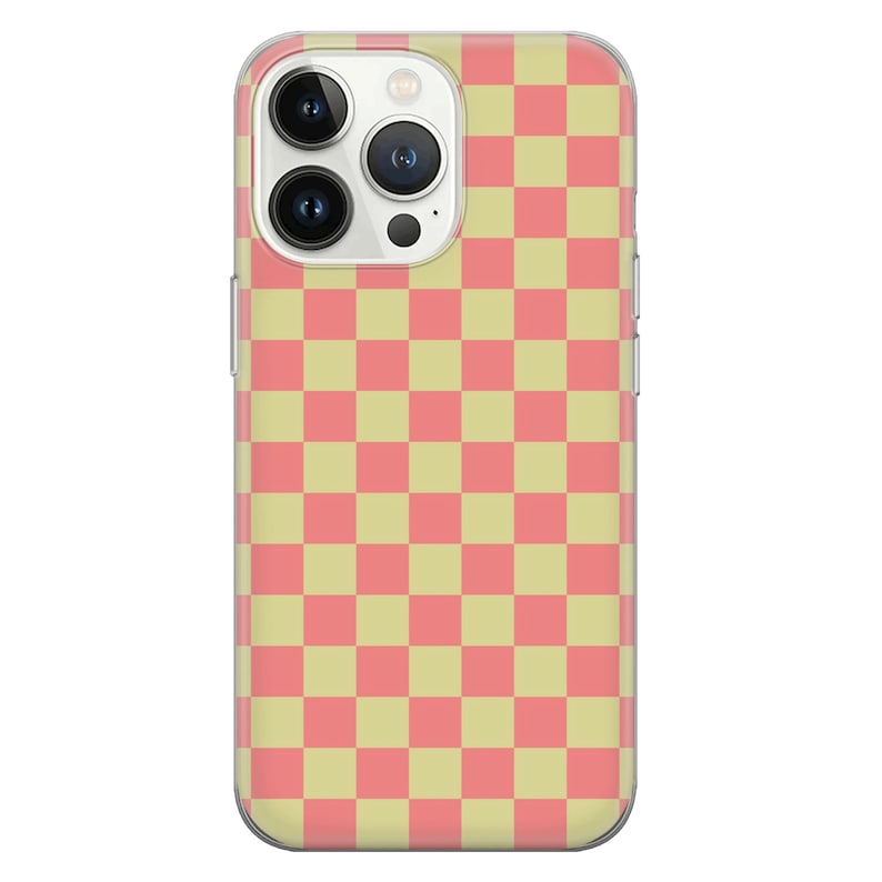 May include: A clear phone case with a pink and yellow checkered pattern. The case is designed for an iPhone.