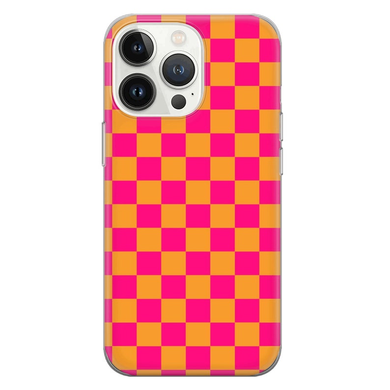 May include: A clear phone case with a checkered pattern in pink and orange.