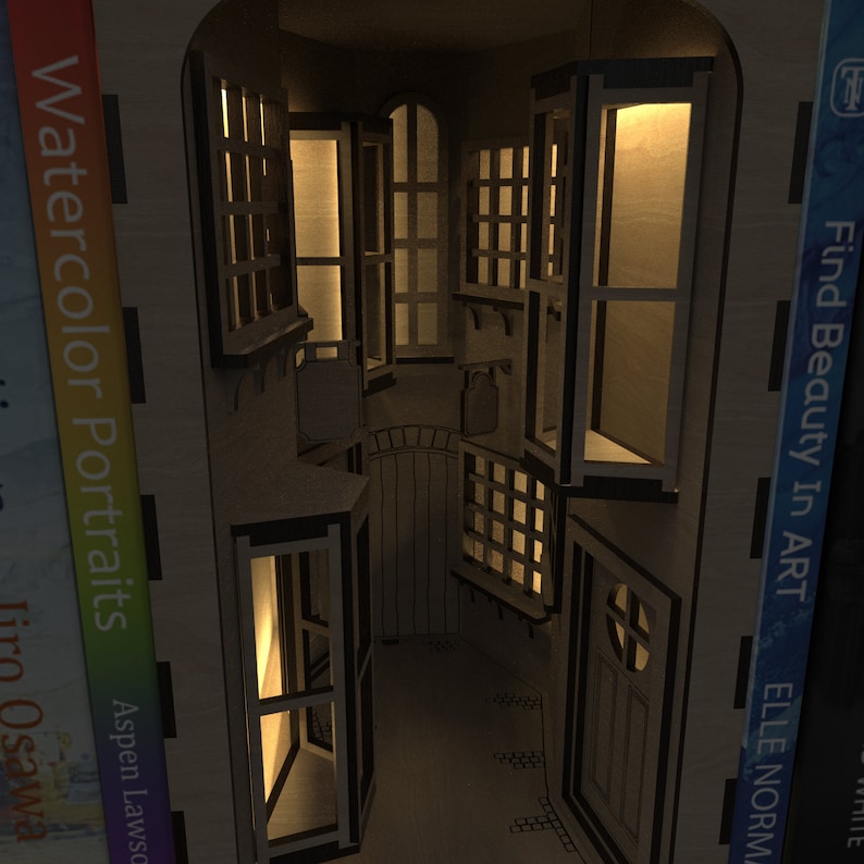 A night time view of our enchanting Magic Alley Book Nook Kit, with illuminated windows and doors, perfect for enhancing bookends and bookshelf décor, crafted from our downloadable SVG laser cutting files.