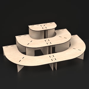 3 Tier Laser Cut Modular Display Stands made from our Svg Laser Cutting Files Digital Download.
A left side corner unit connected to a right side corner unit making a half circle unit.
