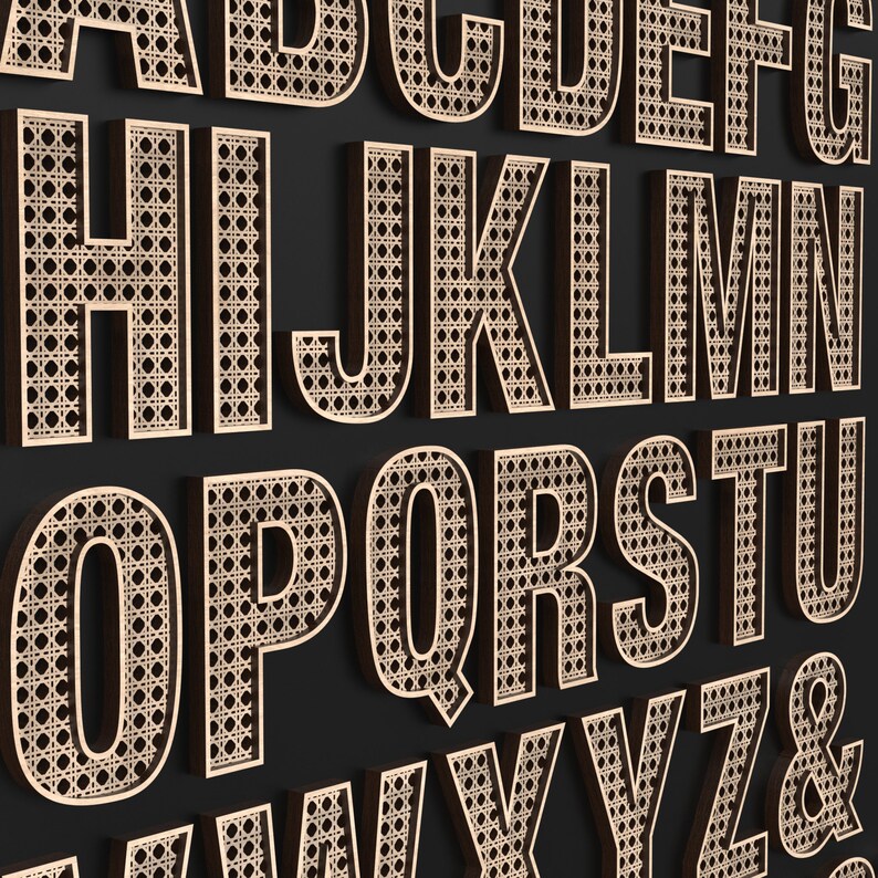 The full Alphabet of wooden letters with each letter having a rattan pattern cut out of the middle of it.