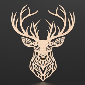 An intricate cut geometric stag head wall plaque cut out of wood placed on a wall.