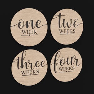 4 Weeks Baby Monthly Milestone Discs made from our Svg Laser Cutting Files Digital Download.
