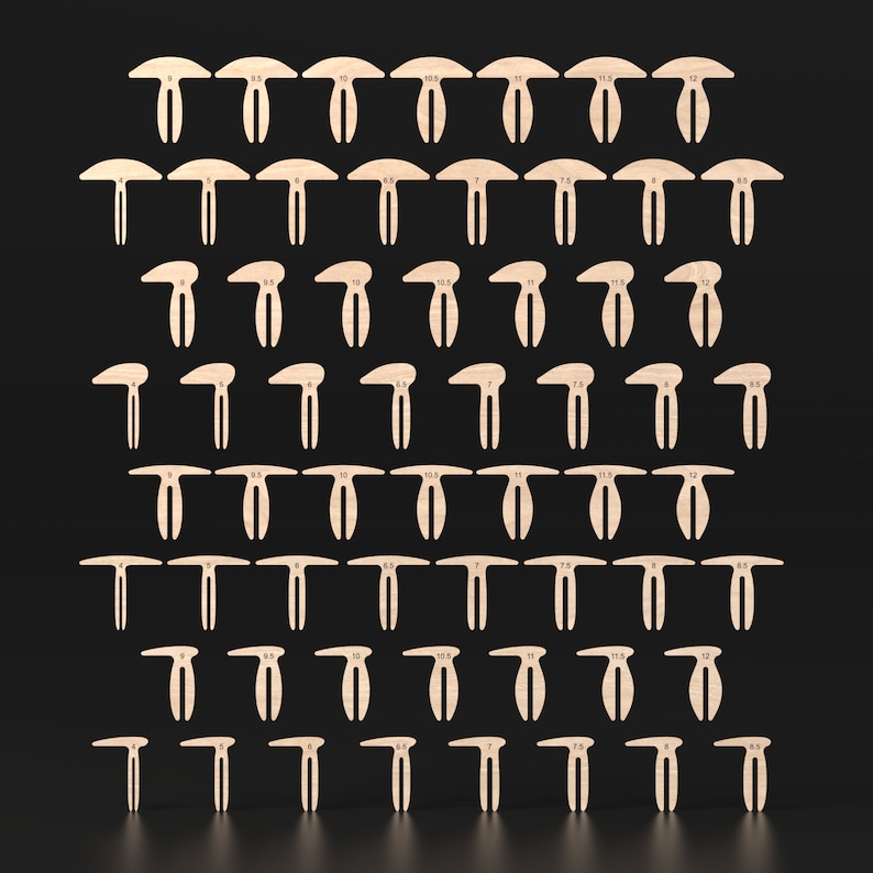 A set of 60 wooden Honeycomb bed pins for use as material hold down clamps aligned in an array. The laser cutting files include 4 different designs with 15 different sizes of each type