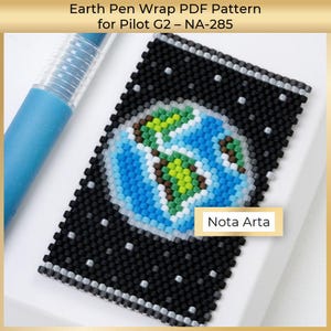 May include: A black beaded pen wrap featuring a detailed Earth design in blue, green, and brown. The pen wrap has a starry background and the text "Nota Arta" on a small rectangular label. A blue pen is partially visible.