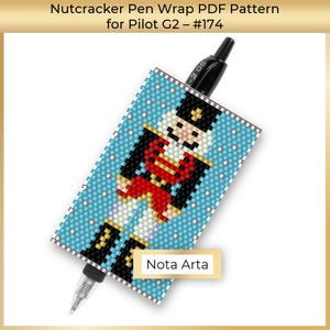 May include: A Nutcracker pen wrap PDF pattern for Pilot G2 pens. The pattern features a blue background with a white and red Nutcracker design. The pattern is available for download from Nota Arta.
