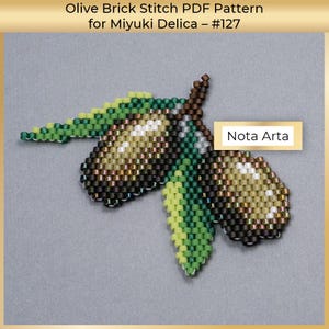 May include: A beaded olive branch pattern in green, brown and white colours. The pattern is called "Olive Brick Stitch PDF Pattern for Miyuki Delica - #127" and is by Nota Arta.