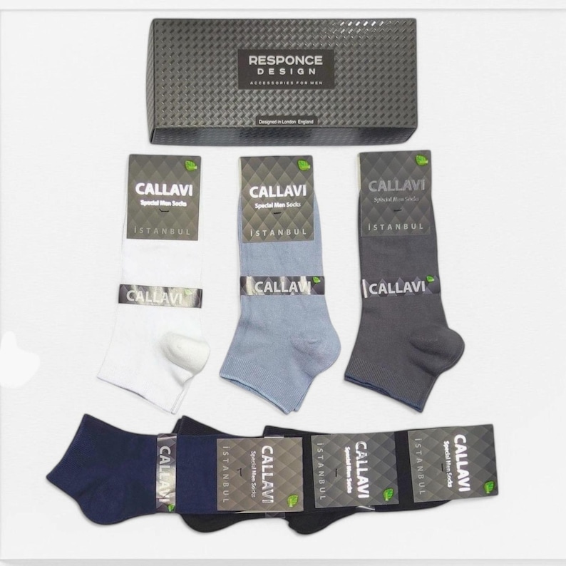 Callavi men's socks in various colors including white, gray, and charcoal, accompanied by a Responce Design packaging box, emphasizing stylish and quality footwear accessories